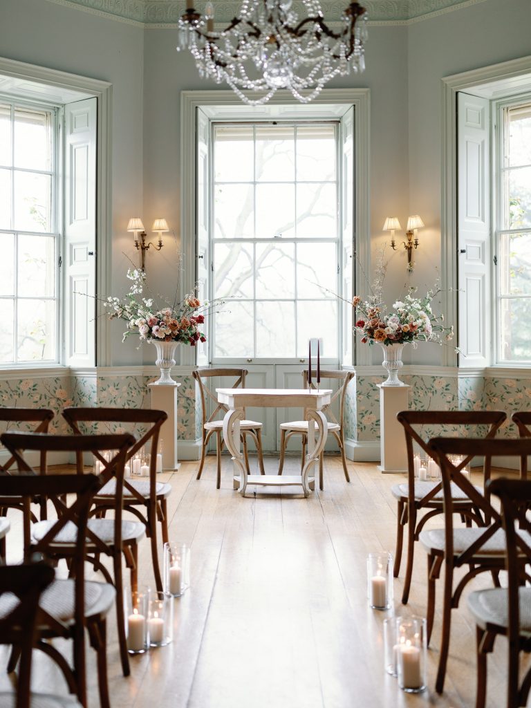 The ceremony set up at the Main House at Middleton Lodge. Including two floral urn installations either side of the aisle.